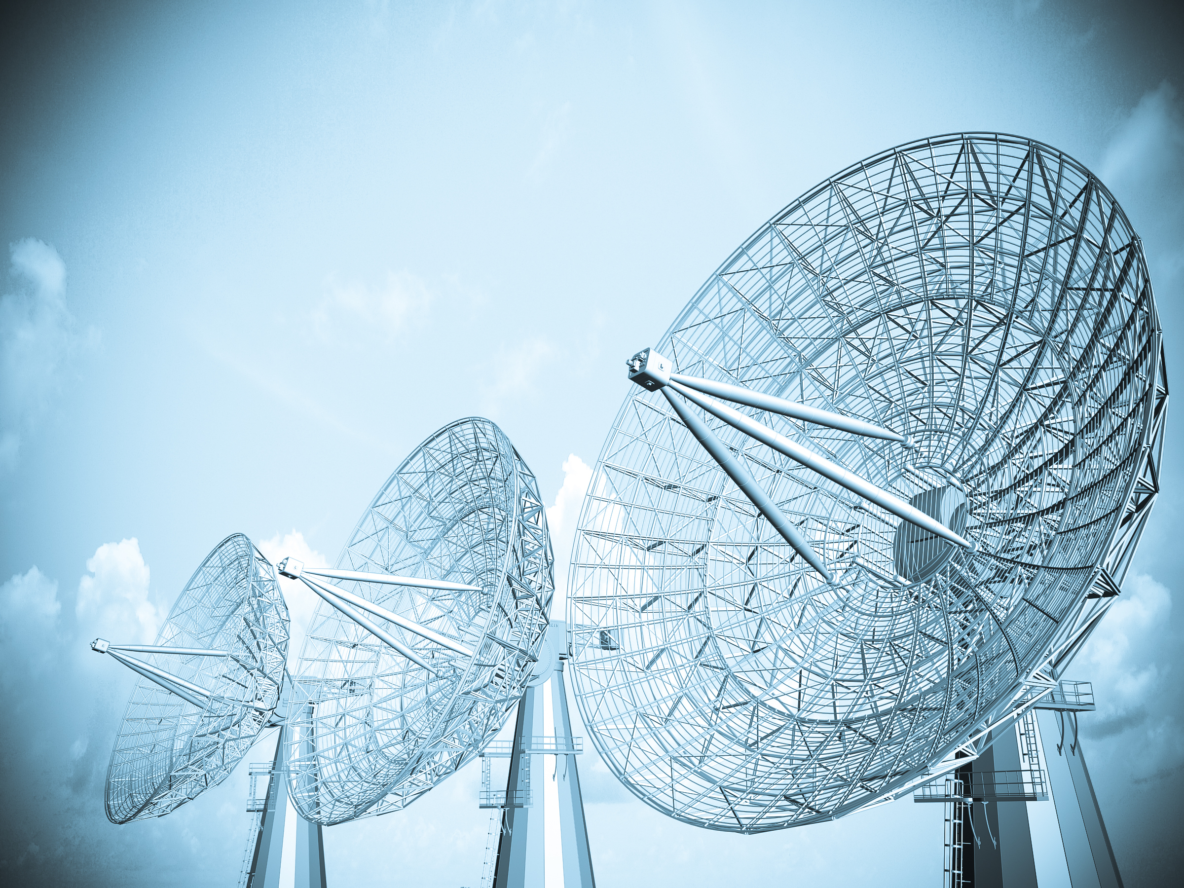 Three Large Satellite Dish Transmitters in a Row.