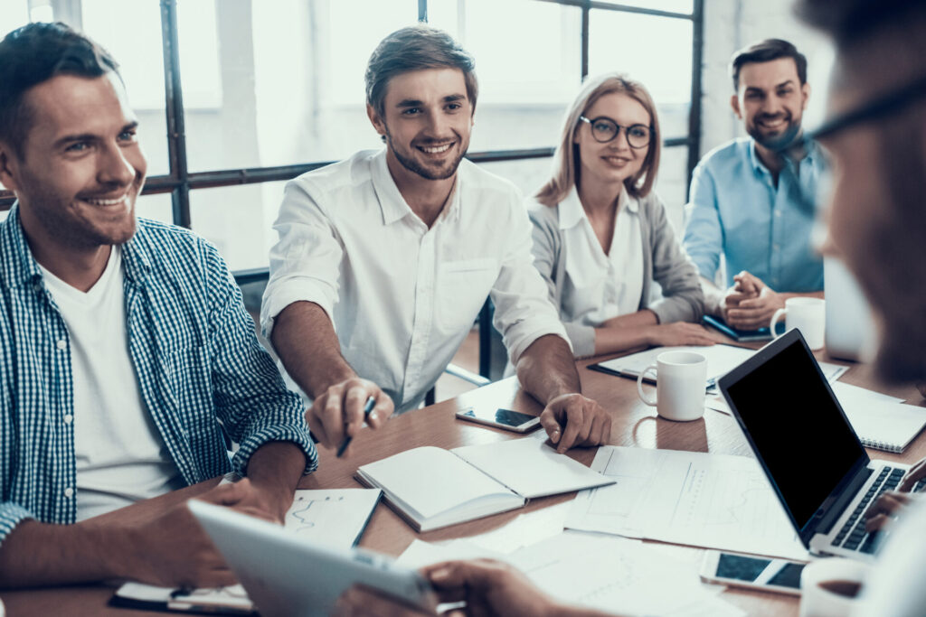 A group of professionals in a meeting room.