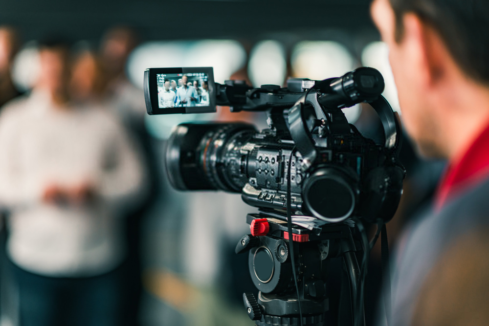 A videographer shooting a video.