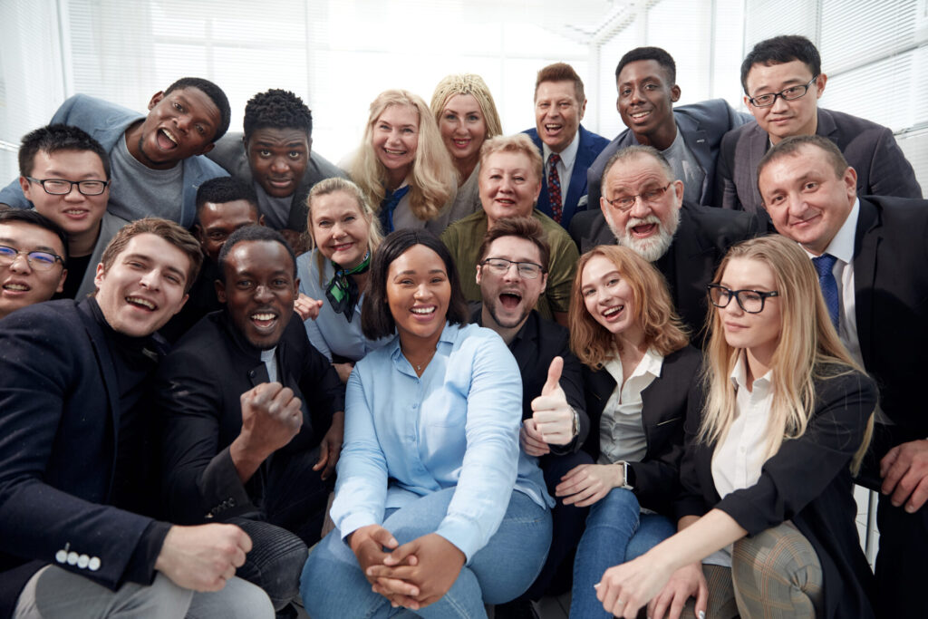 Happy business team posing at workplace in office